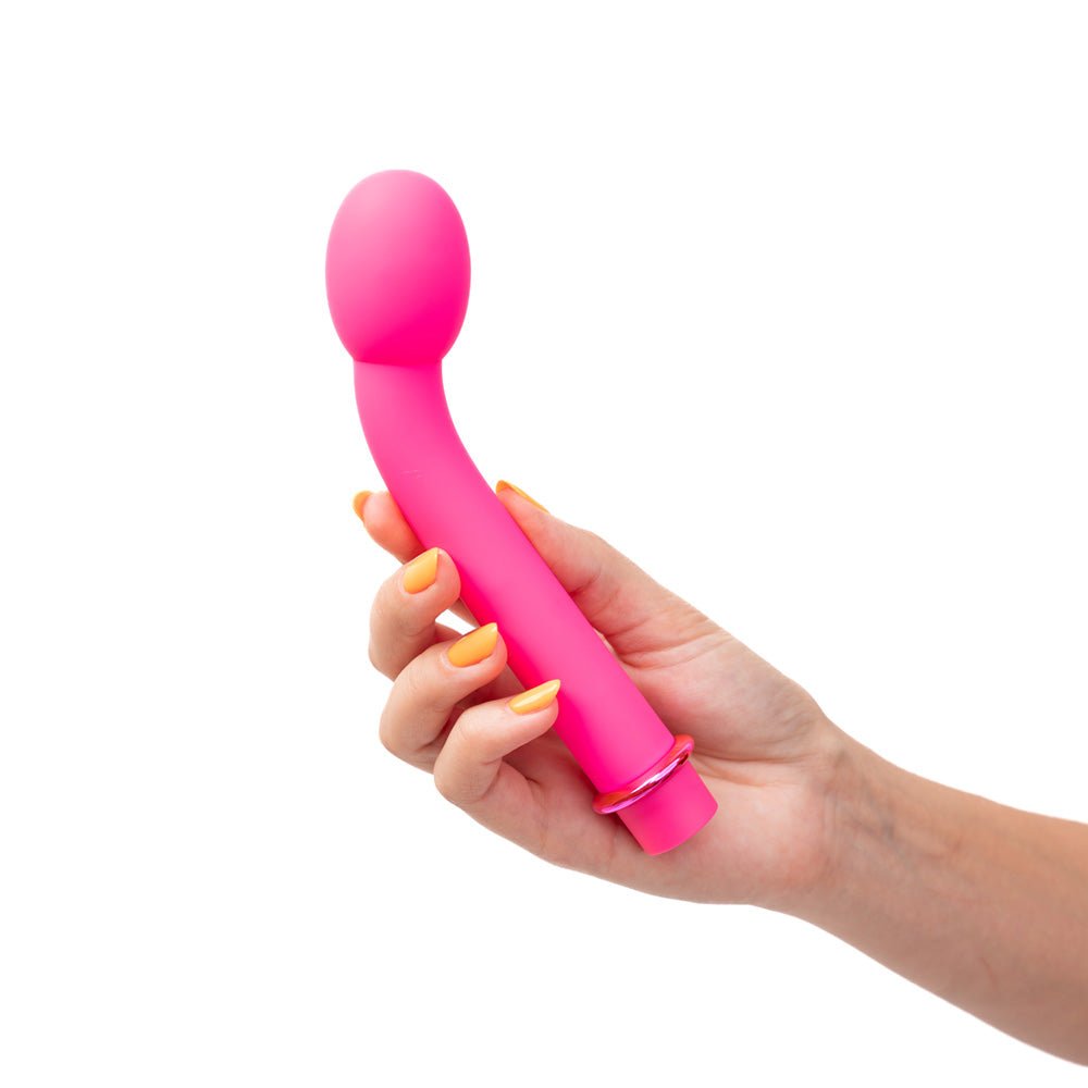 Maia KORA for intense G - Spot or P - Spot stimulation pink vibrator in womans hand with white background