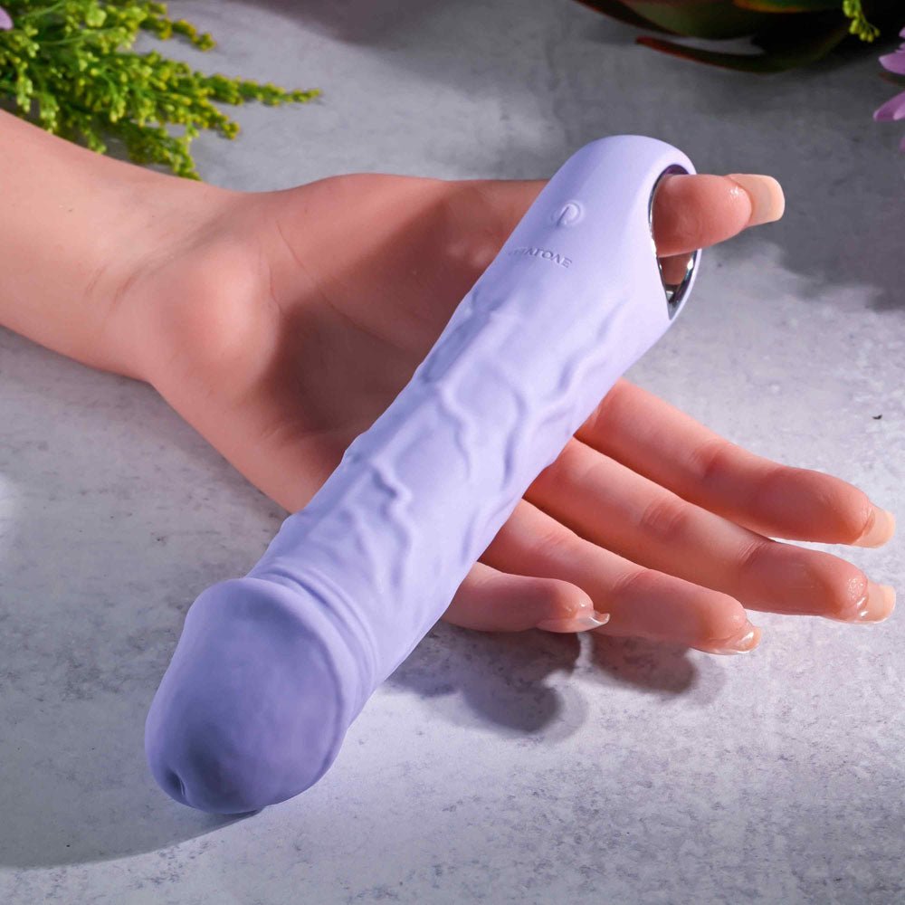 Evolved PURPLE FANTASY Phallic Multi - Speed Vibrator in womans open hand 