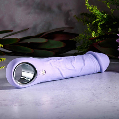 Evolved PURPLE FANTASY Phallic Multi - Speed Vibrator - on its side displaying charge port