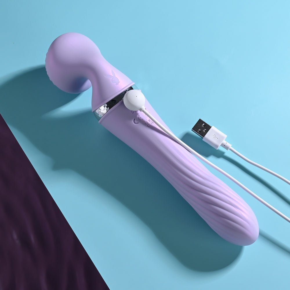 Playboy Pleasure Vibrato DUAL - ENDED vibrating Wand on light blue background side view with charging cable 2